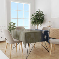 Veterans Day tablecloth, olive camo print with navy star corner detail on dining table