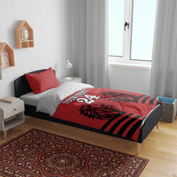 Red and black duvet bedding set with red pillowcases, lion heads graphic and bold stripe bands
