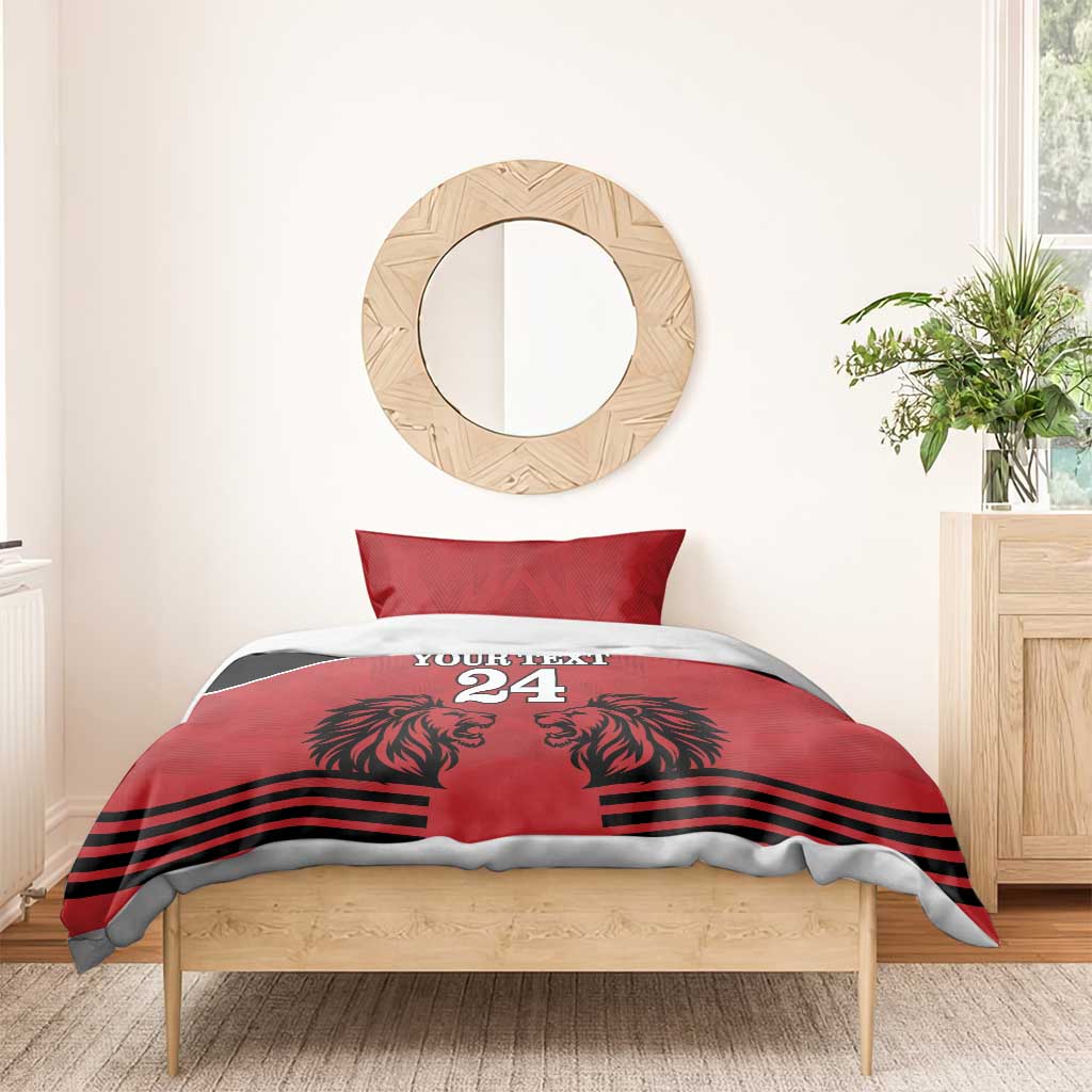 Red and black duvet bedding set with pillow, lion heads graphic, stripes, and '24'