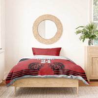 Red and black duvet bedding set with pillow, lion heads graphic, stripes, and '24'