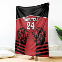 Red & black rugby blanket hanging, lion heads with 'Your Text' and number 24