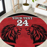 Red round rug with black lion faces, custom text and number 24, circular border