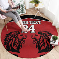 Red round rug with black lion faces and 'YOUR TEXT 24' center print