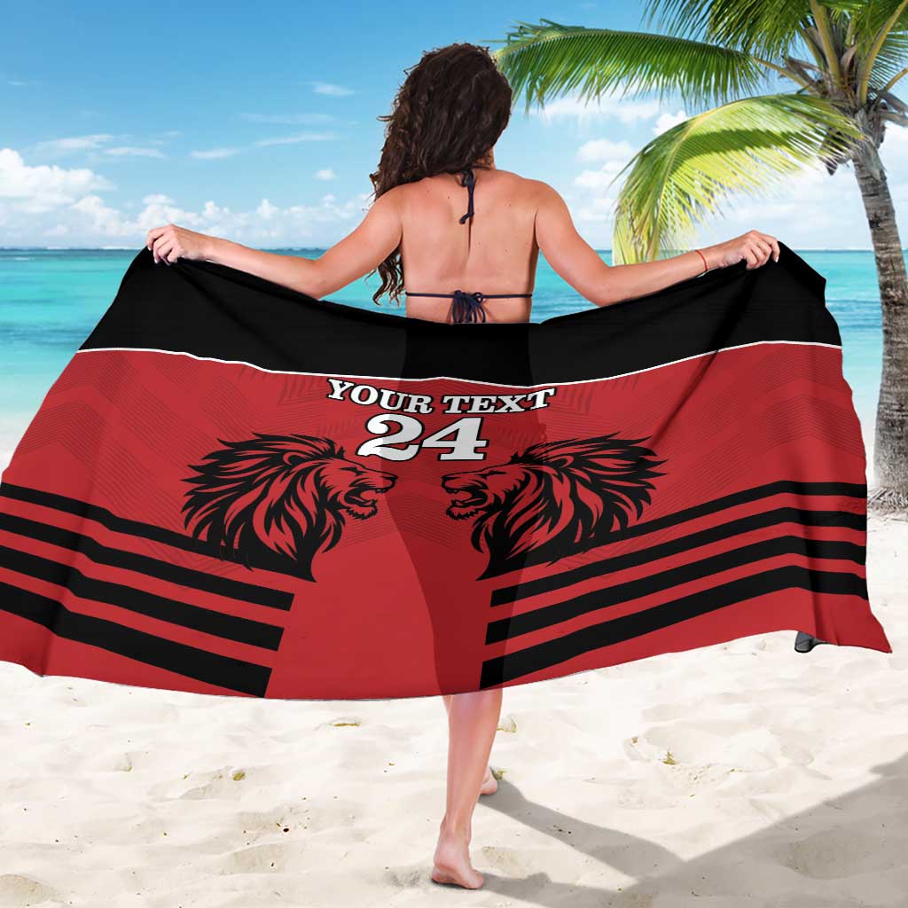 Red and black sarong with central lion face, 'YOUR TEXT 24' text, and horizontal stripes