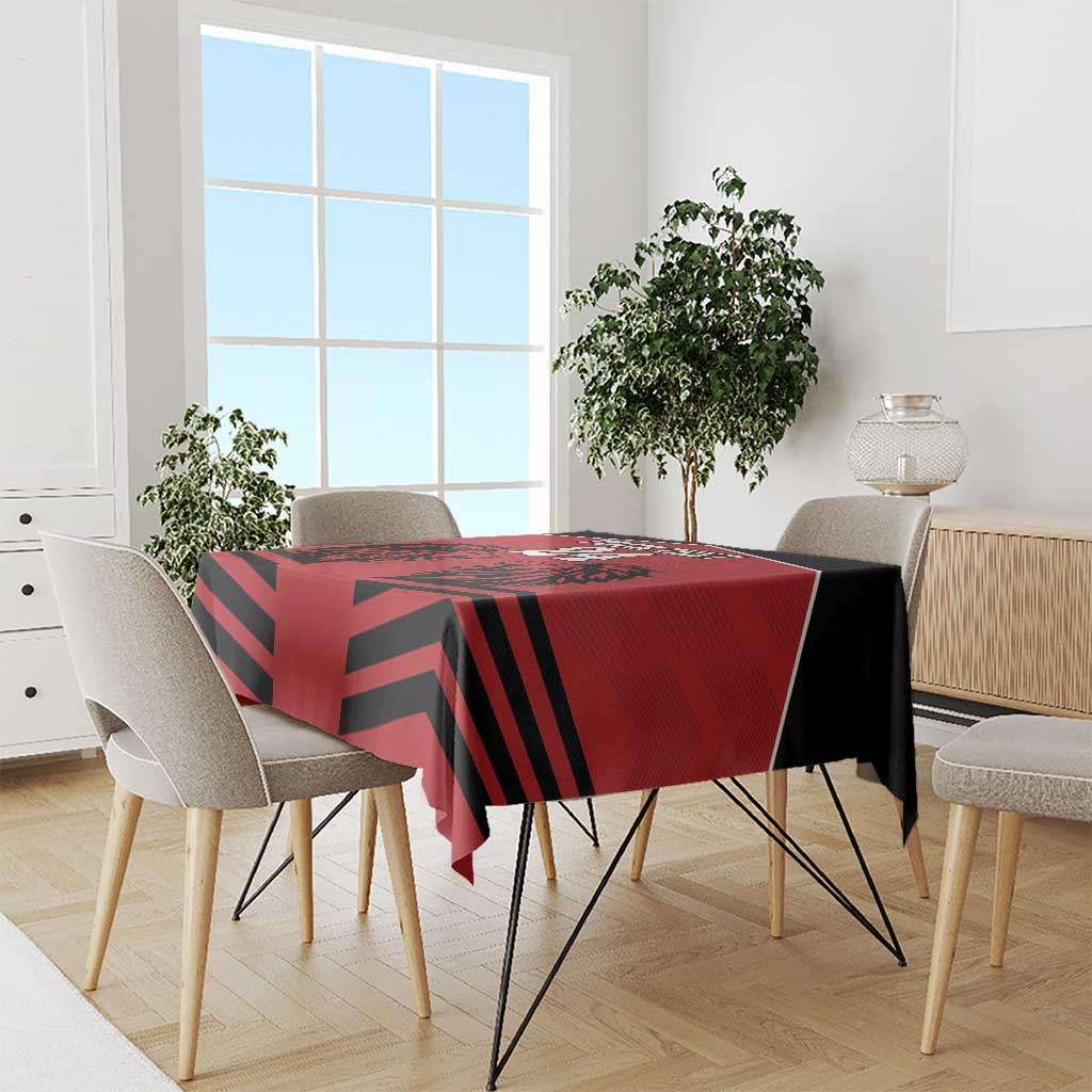 Red tablecloth with black diagonal stripe rugby pattern