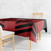 Red and black diagonal rugby stripe tablecloth draped on bench