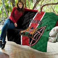Personalized Kenya quilt draped on lap, black red green flag design with YOUR TEXT