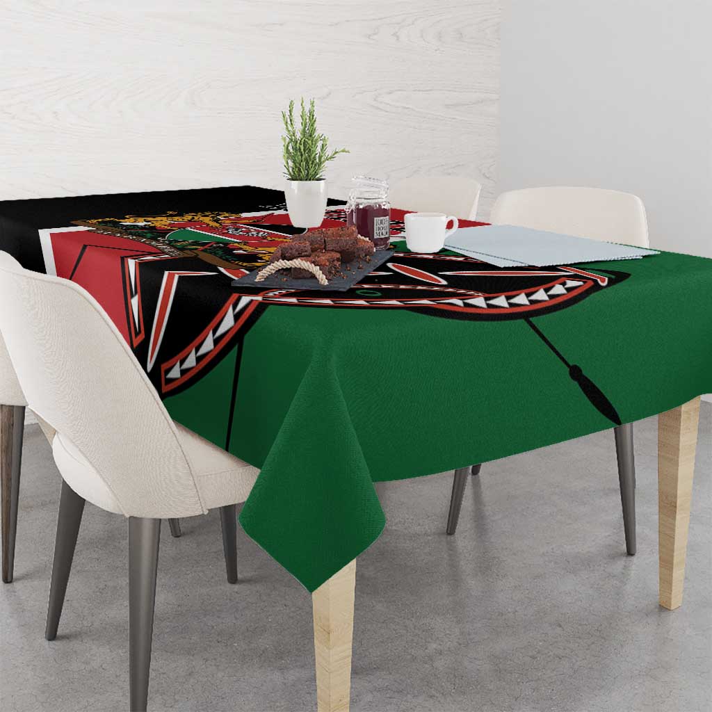 Green tablecloth draped on dining table, showing black and red graphic border