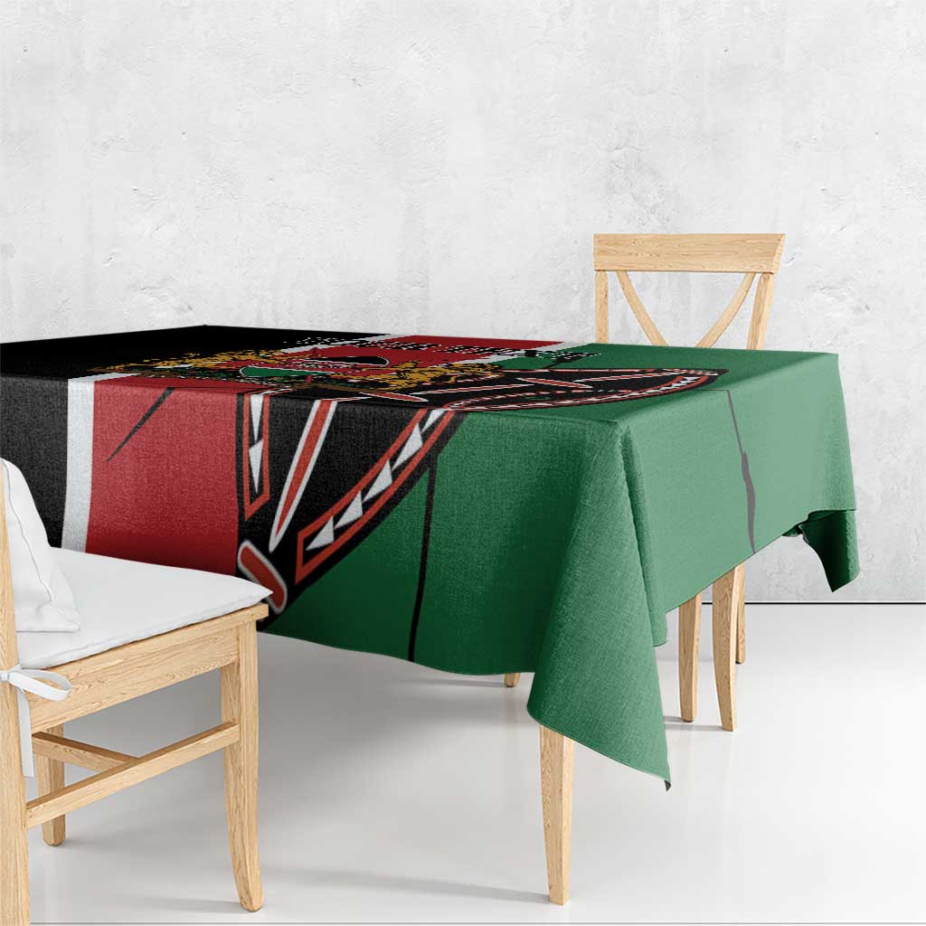 Green and black patterned tablecloth with red stripe, hanging over bench table