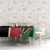 Green and black printed tablecloth with red panel on dining table in room