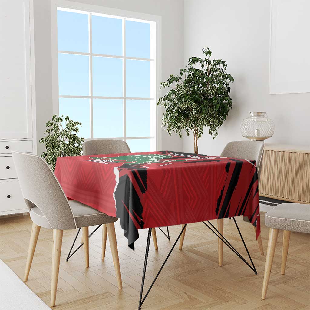 Red tablecloth with Kenya lion design draped over dining table