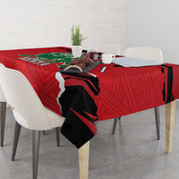 Red tablecloth with black lion silhouette and Kenya text on table