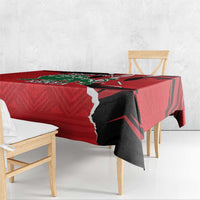 Red Kenya tablecloth with lion graphic and black jagged border on table