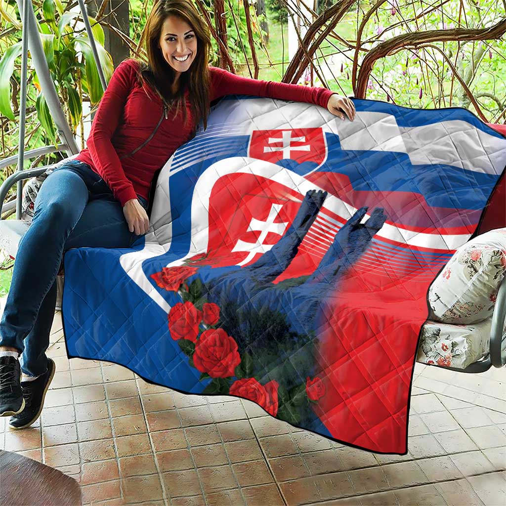Slovakia quilt draped over couch with castle silhouettes, roses, and flag colors