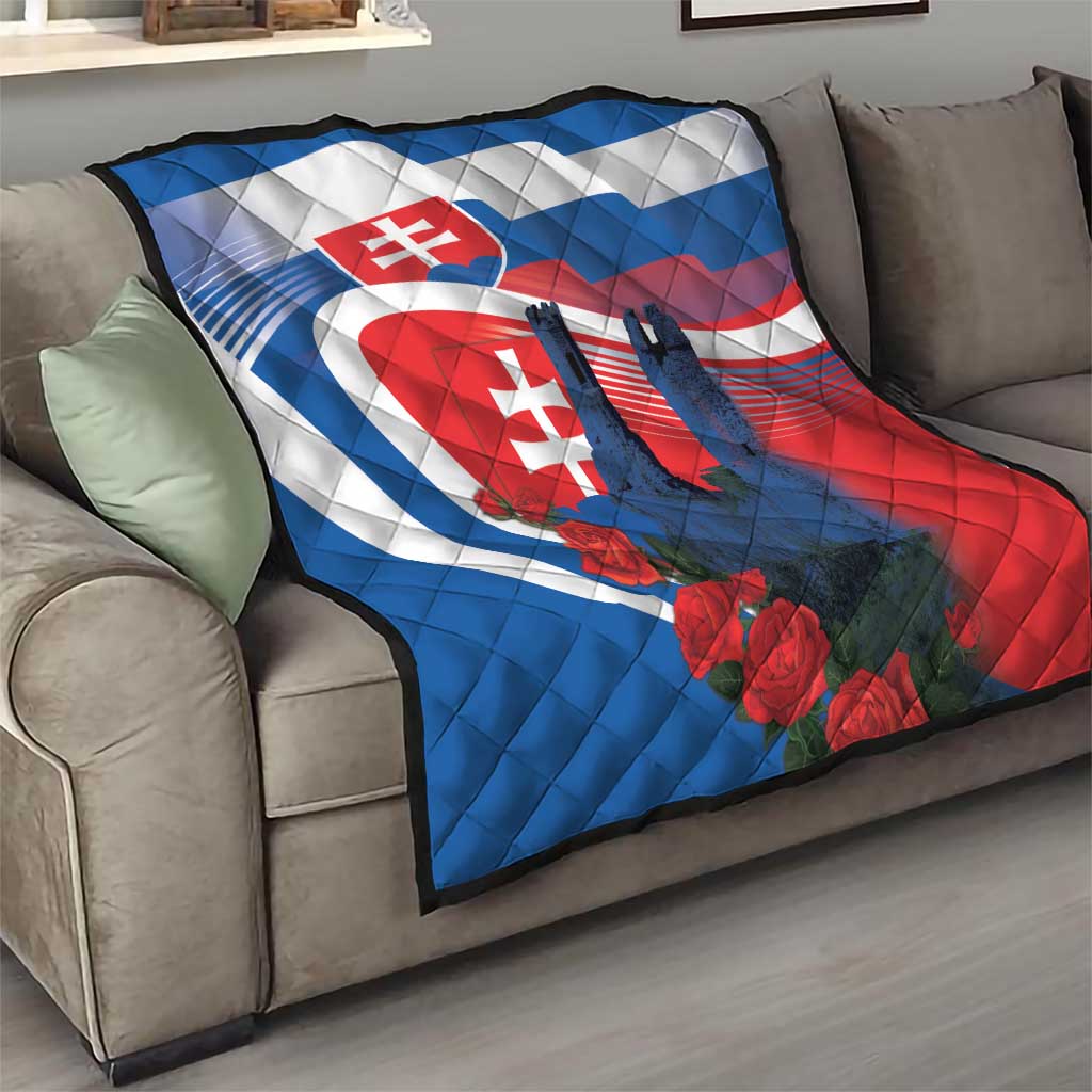 Slovakia-themed quilt on living room couch with castle silhouettes and red roses