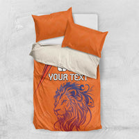 Orange lion bedding set with 'YOUR TEXT' on duvet and two matching pillowcases