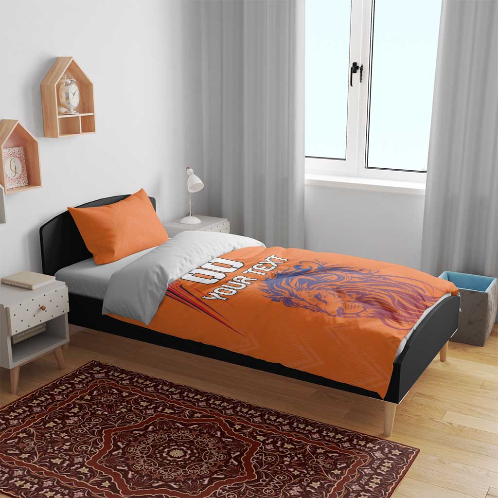 Orange bedding set on bed with lion graphic and 'DO YOUR TEXT' printed on duvet