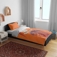Orange bedding set on bed with lion graphic and 'DO YOUR TEXT' printed on duvet