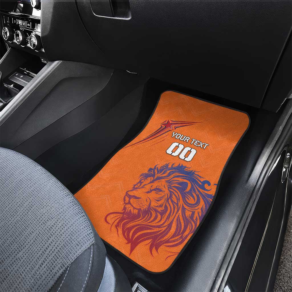 Orange car floor mat with lion graphic and "YOUR TEXT" on the front passenger area