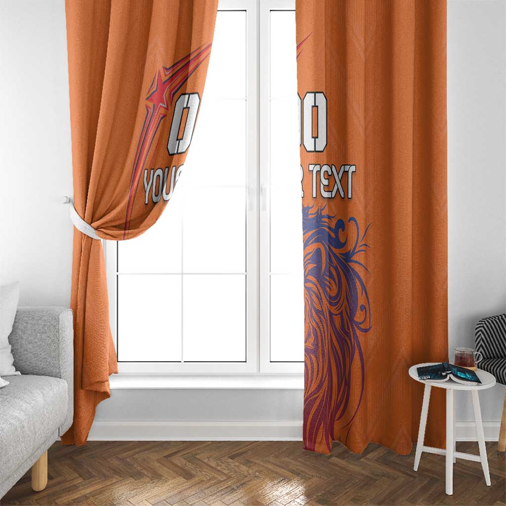 Orange window curtains with blue lion print and custom text, side view by glass door