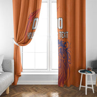Orange window curtains with blue lion print and custom text, side view by glass door