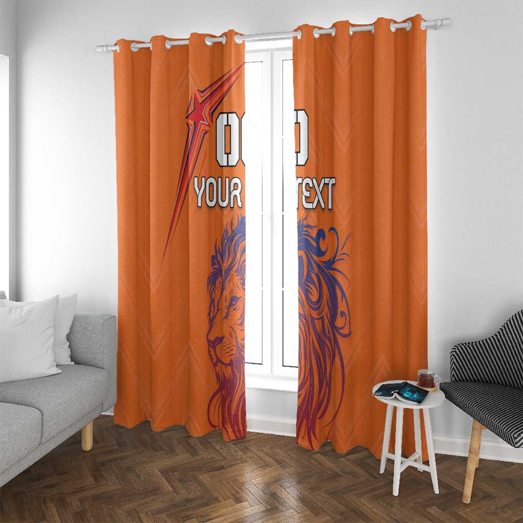 Orange window curtains with blue lion print and custom text; hook header visible