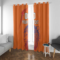 Orange window curtains with blue lion print and custom text; hook header visible