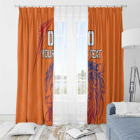 Orange window curtains with blue lion graphic and custom text, pleated with hooks