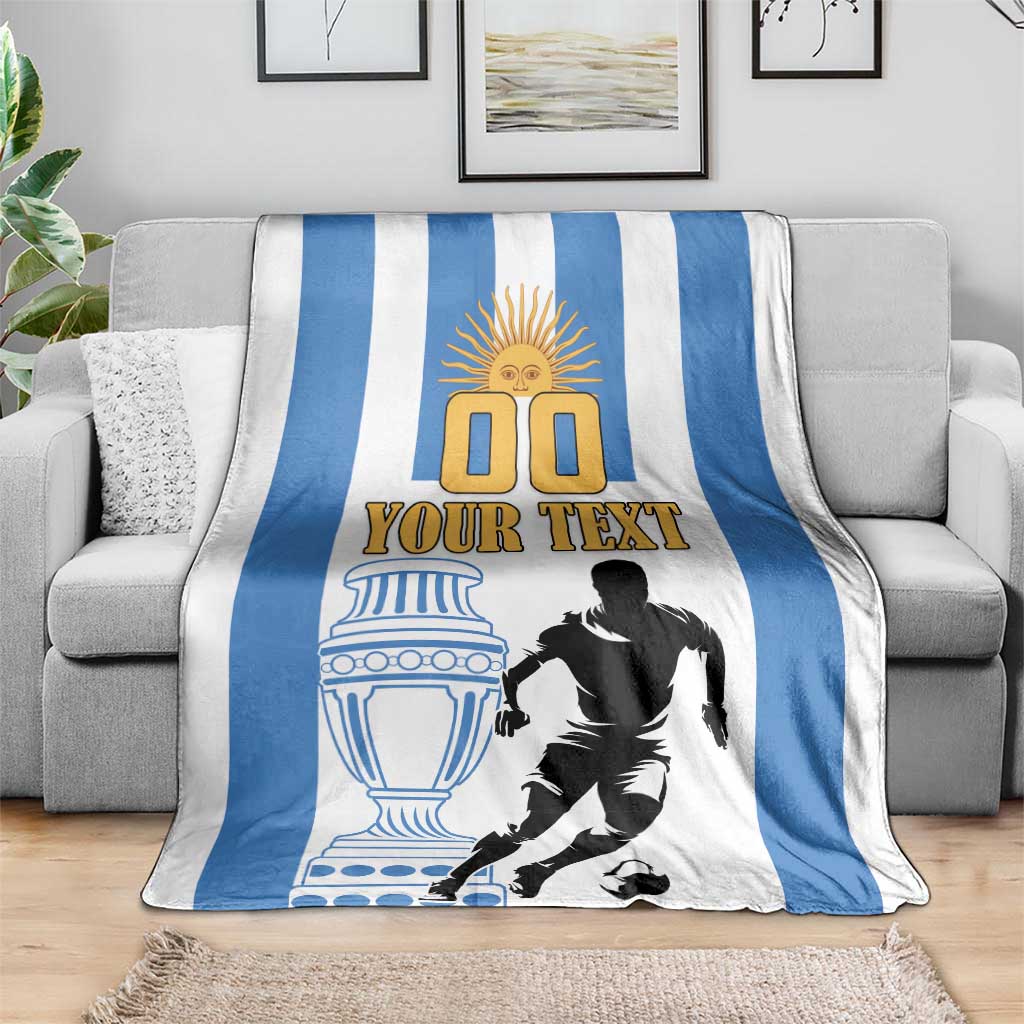Argentina football blanket draped over sofa, blue stripes, “Your Text”, player print