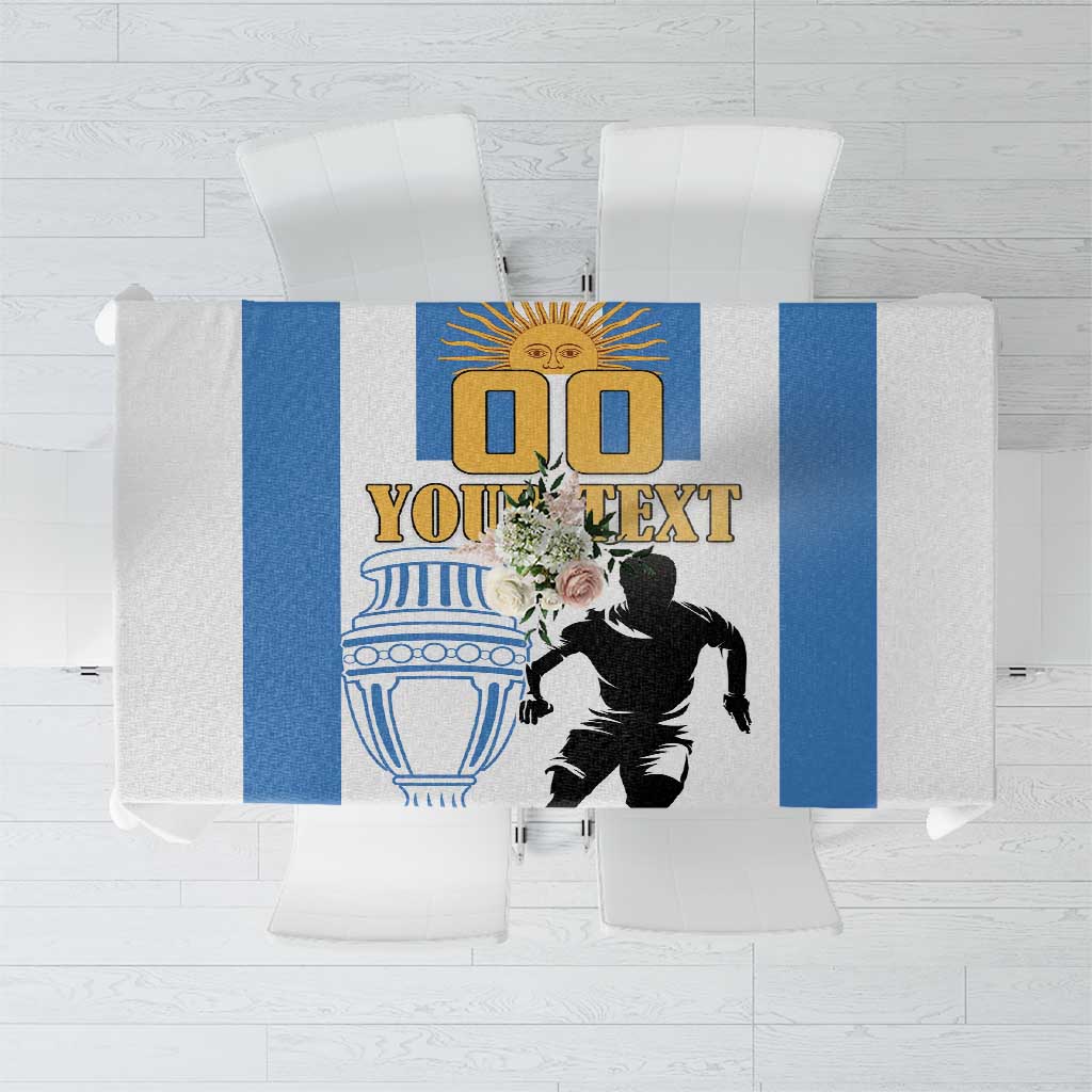 White Argentina football tablecloth, centered design with blue bars, banner text, player figure.