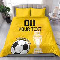Yellow football duvet and pillowcases featuring soccer ball and trophy emblem design