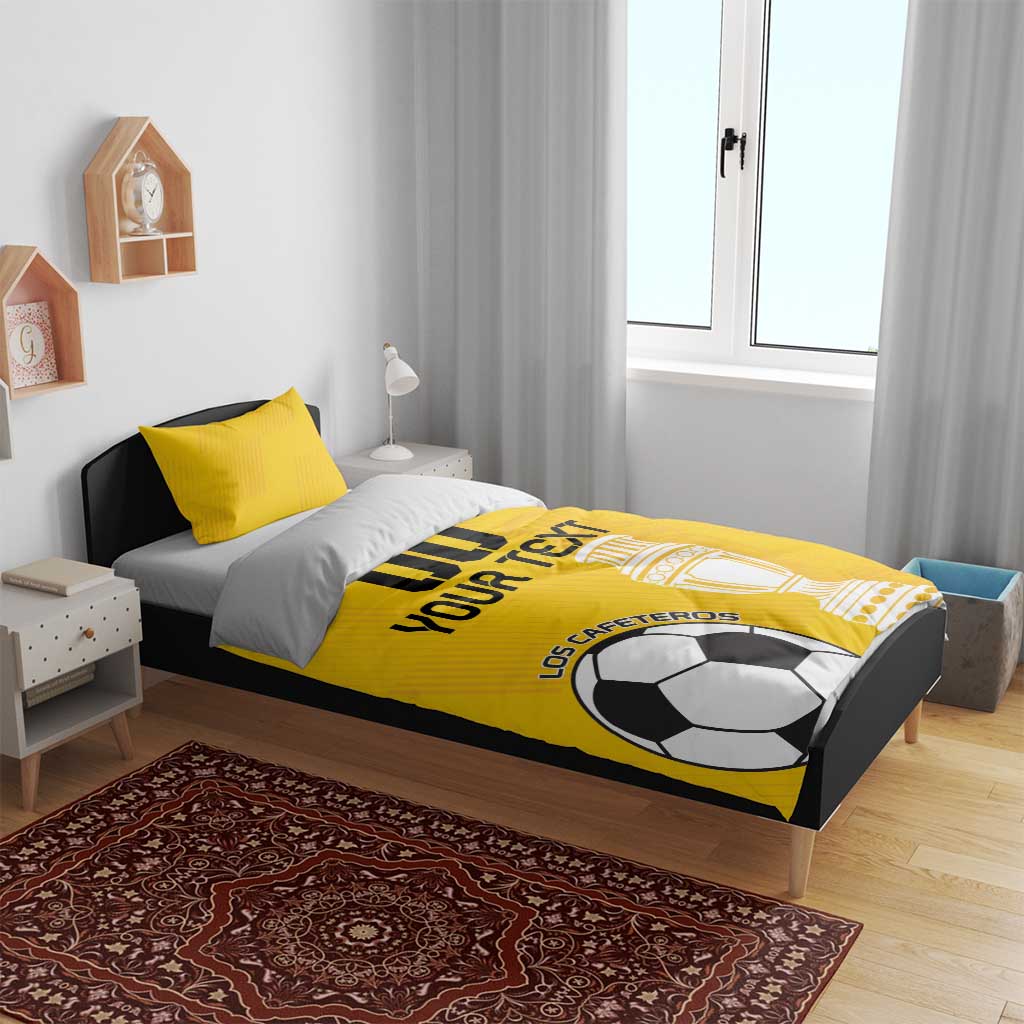 Yellow football bedding set on bed, duvet shows soccer ball and trophy graphics