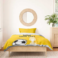 Yellow football duvet with soccer ball and trophy print, matching pillowcase visible