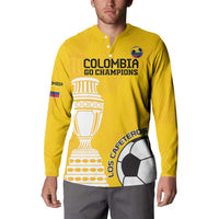 Yellow button sweatshirt worn by a man, featuring Colombia Go Champions logo and Los Cafeteros artwork