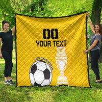 Yellow football quilt with diamond stitching, soccer ball and trophy logos