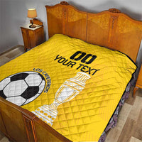 Yellow football quilt on bed, diamond stitching, soccer ball and trophy design