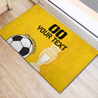 Yellow custom rubber football doormat featuring “Your Text” and trophy with soccer ball.