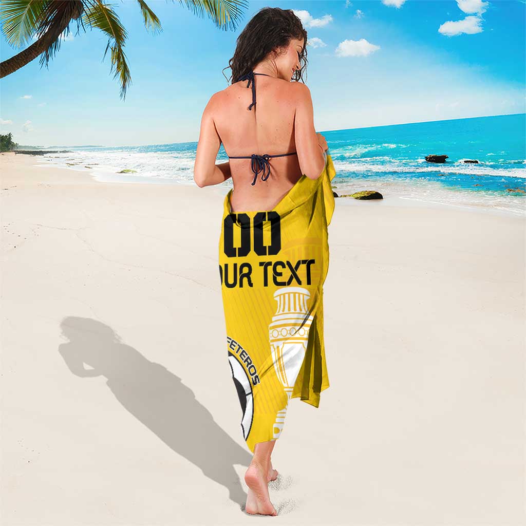 Yellow football sarong worn back view, with "GO" graphic and crest