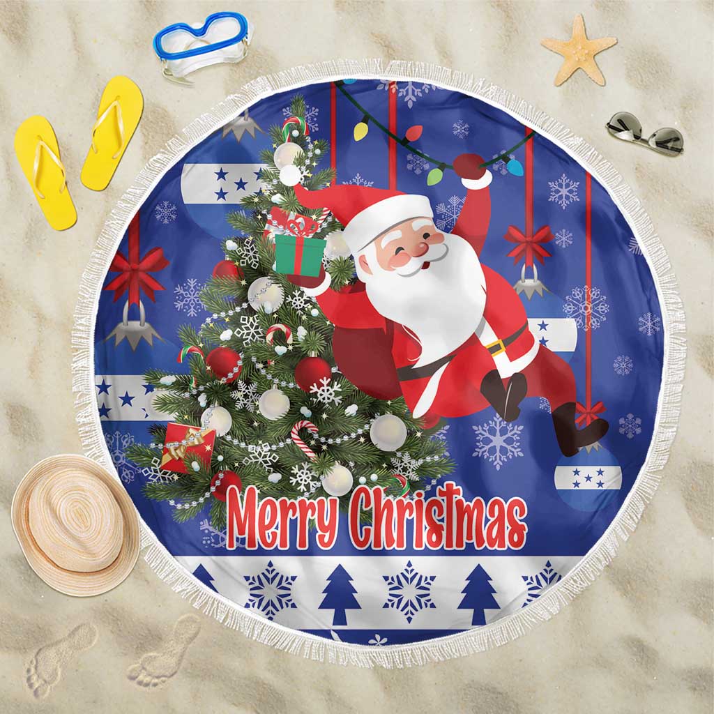 Blue round Christmas beach blanket with Santa, decorated tree, and “Merry Christmas”