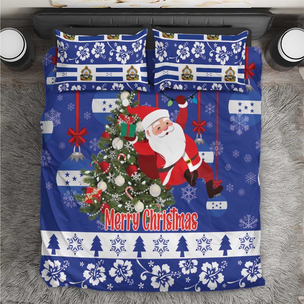 Blue Christmas bedding set with Santa, tree, and “Merry Christmas” text on duvet