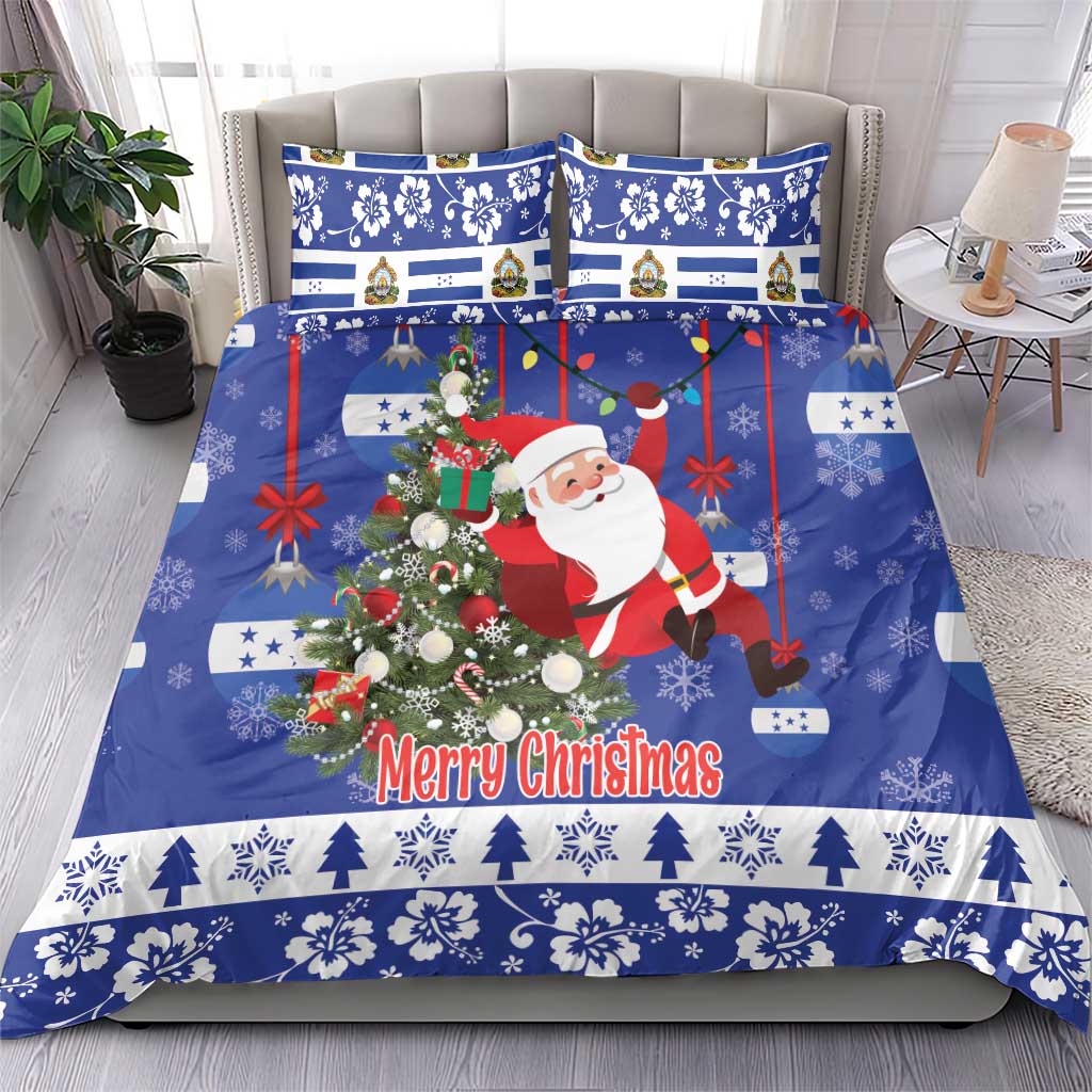 Blue Christmas bedding set on sofa with Santa, wreath, red accents, and “Merry Christmas”