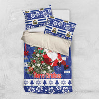 Blue Christmas bedding set with Santa, wreath, and “Merry Christmas” on duvet and pillowcases