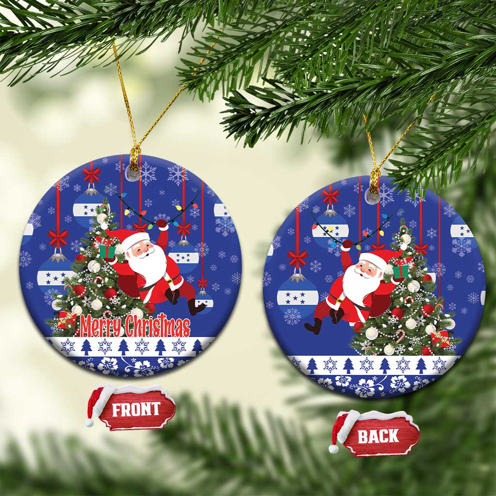Blue round ceramic Christmas ornament with Santa, wreath, and gold hanging loop
