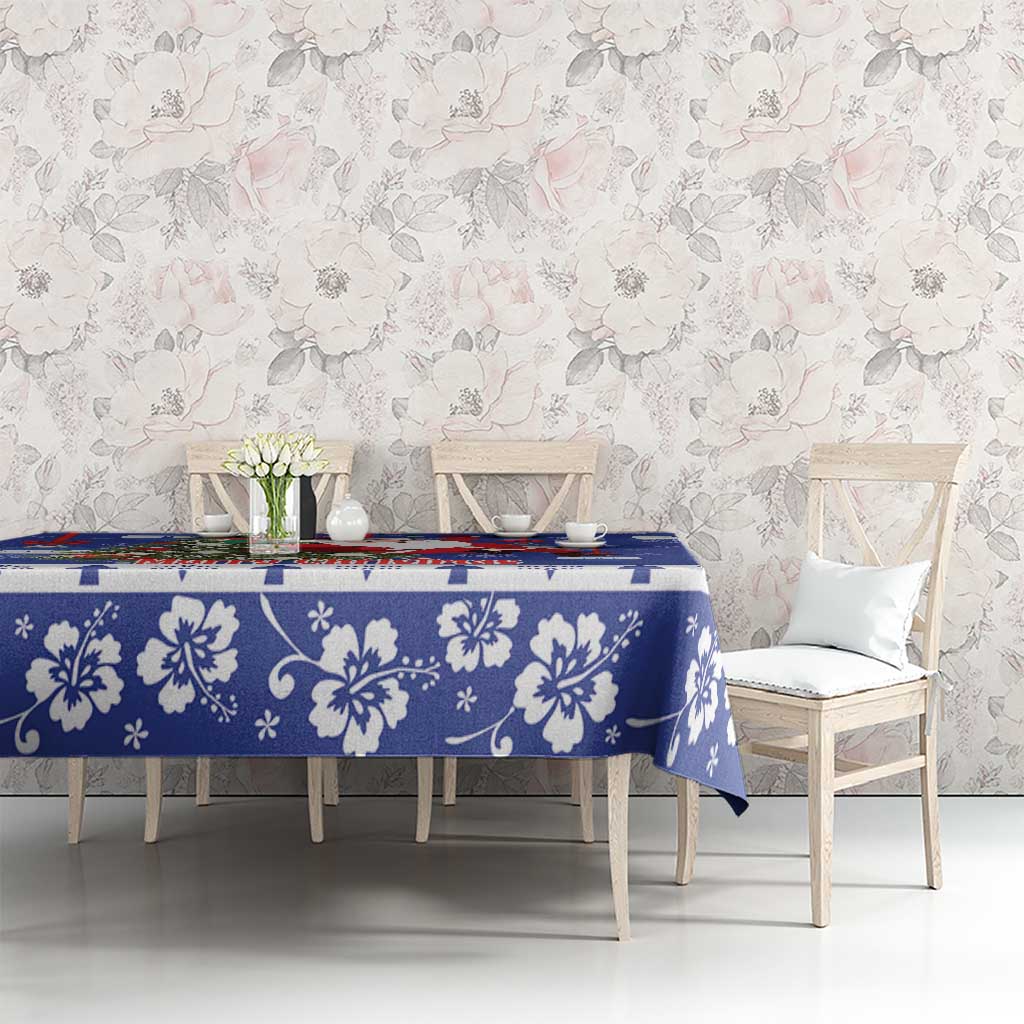 Blue Christmas tablecloth with large white floral pattern and snowflakes on dining set