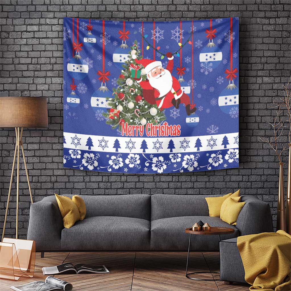 Blue Christmas tapestry with Santa holding a tree and “Merry Christmas” text