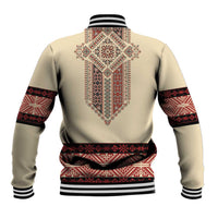 Beige baseball jacket with red traditional embroidery centered on back and striped cuffs