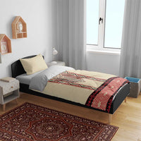 Beige duvet with red and black embroidered band detail in a bedroom setting