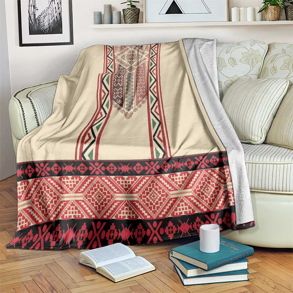 Beige blanket with red and black Romanian-style embroidery stripes and central vertical motif.