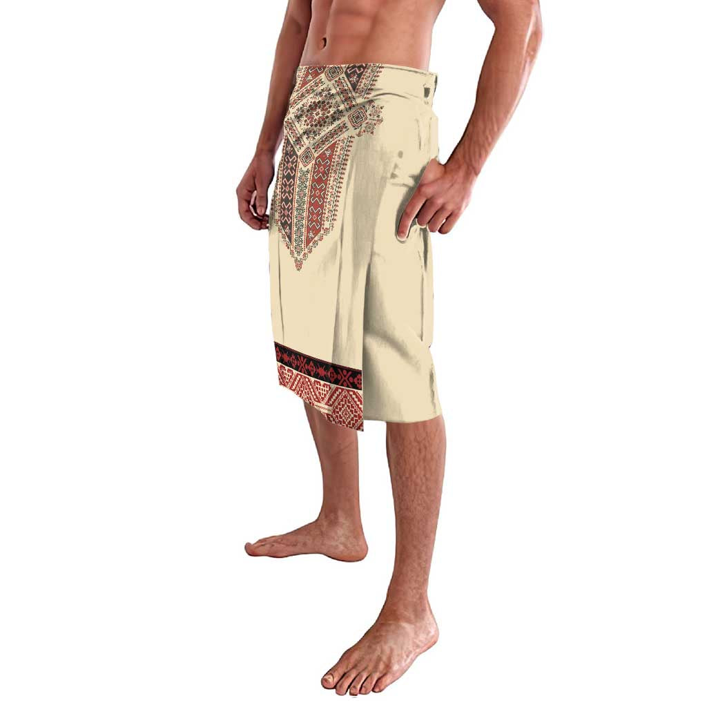 Beige lavalava skirt with red geometric embroidery on front and hem border, side view