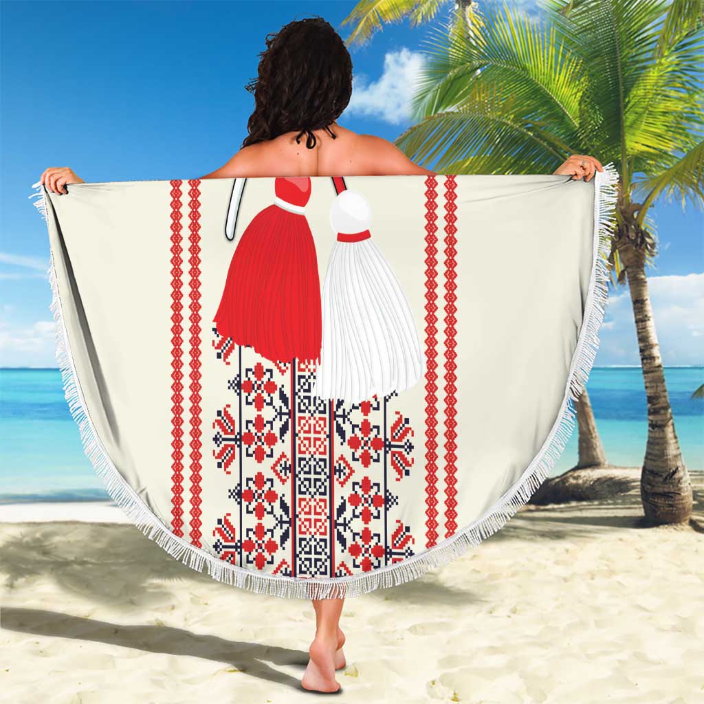 Round beach blanket with fringe edge, white fabric with red folk embroidery figure